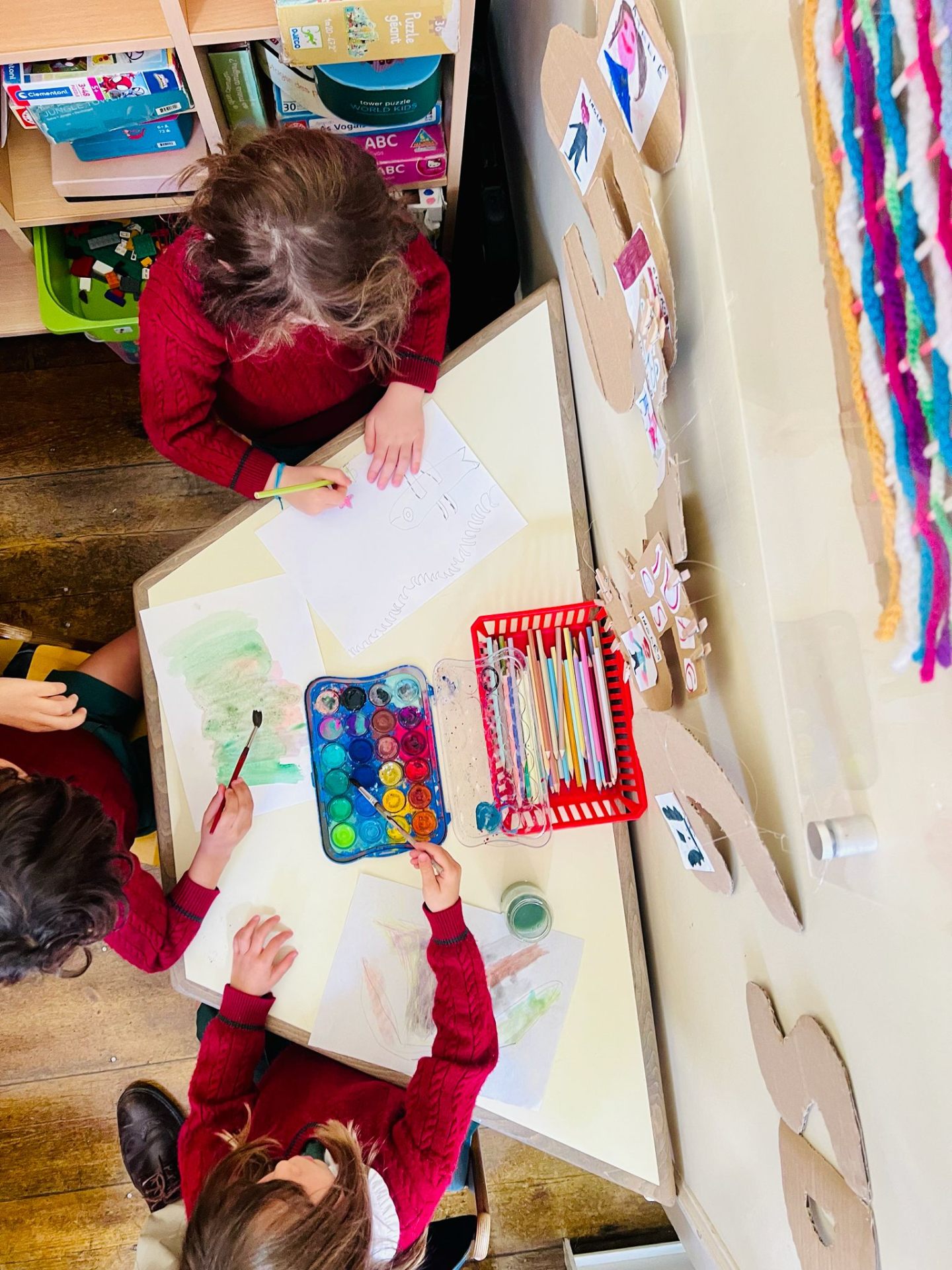Children working on arts and crafts activities at O Lar da Criança